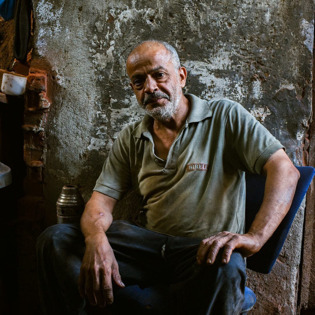 Studio portrait of an older Brazilian man with grey hair