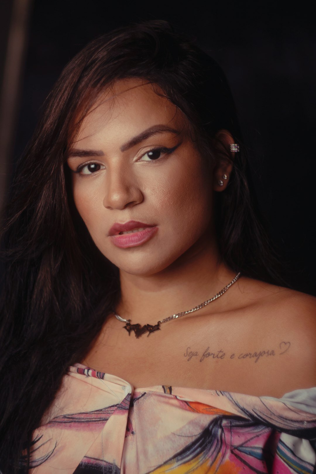 Close up portrait of a Brazilian woman with closed eyes in a reflective calm moment