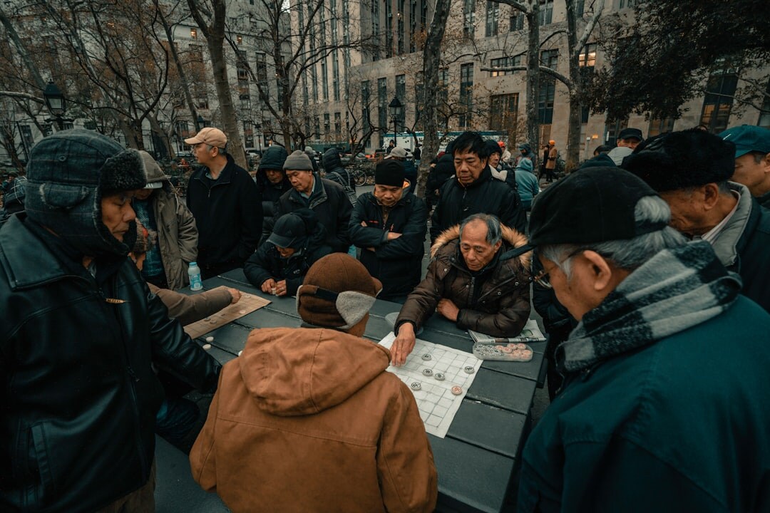 Diverse Brazilian editorial team collaborating around a table with notes