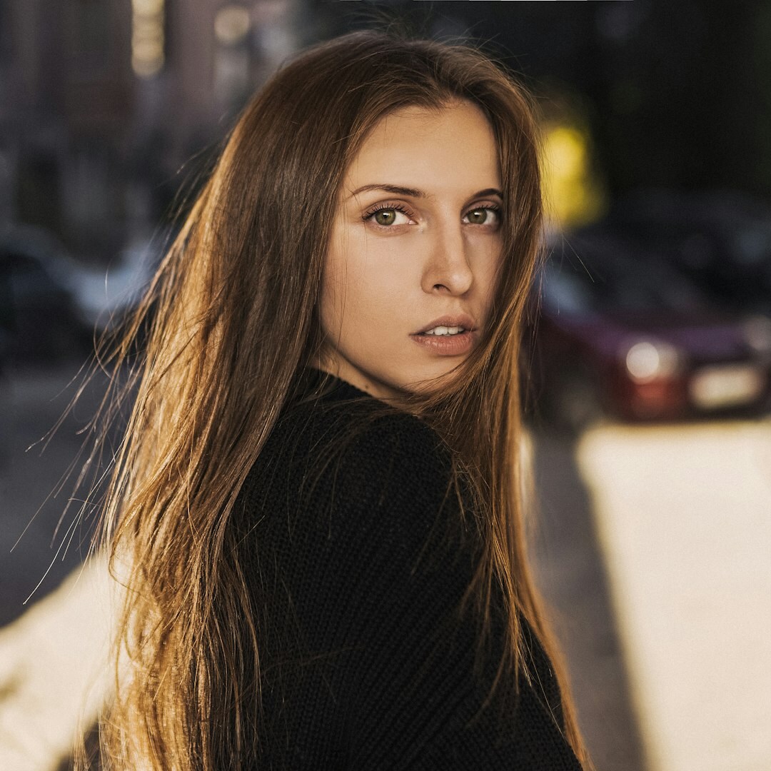 Studio portrait of a young Brazilian woman with long straight hair