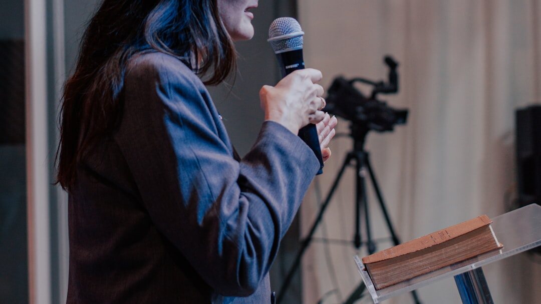 person speaking on stage confidently