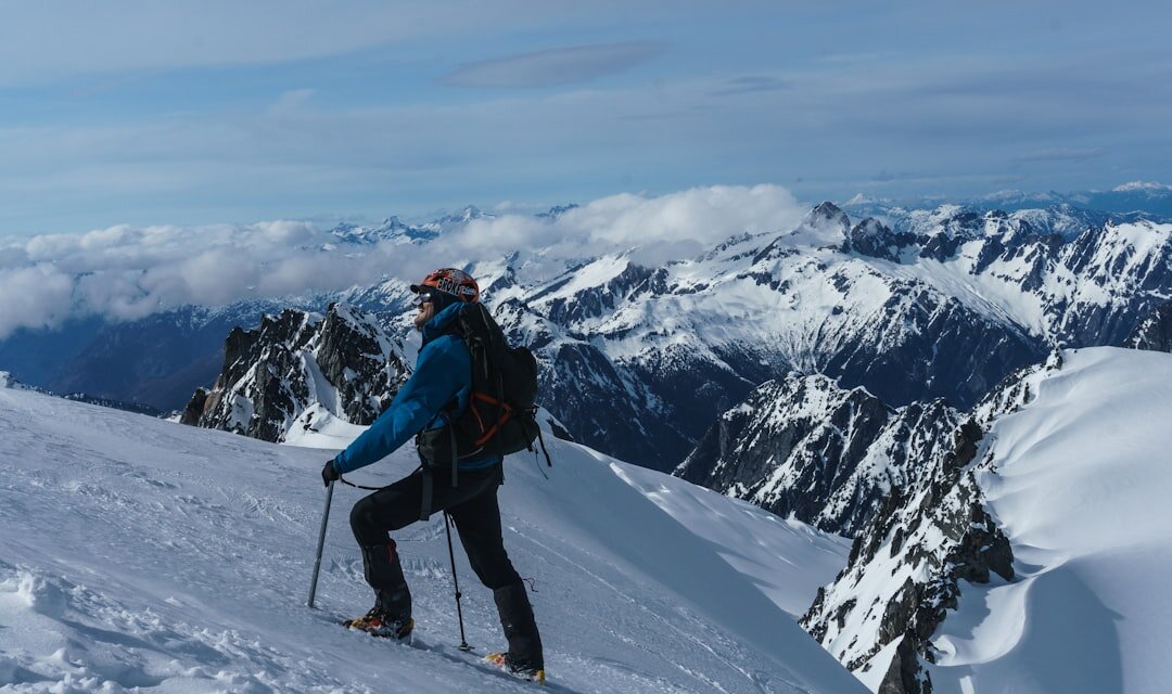 person climbing mountain