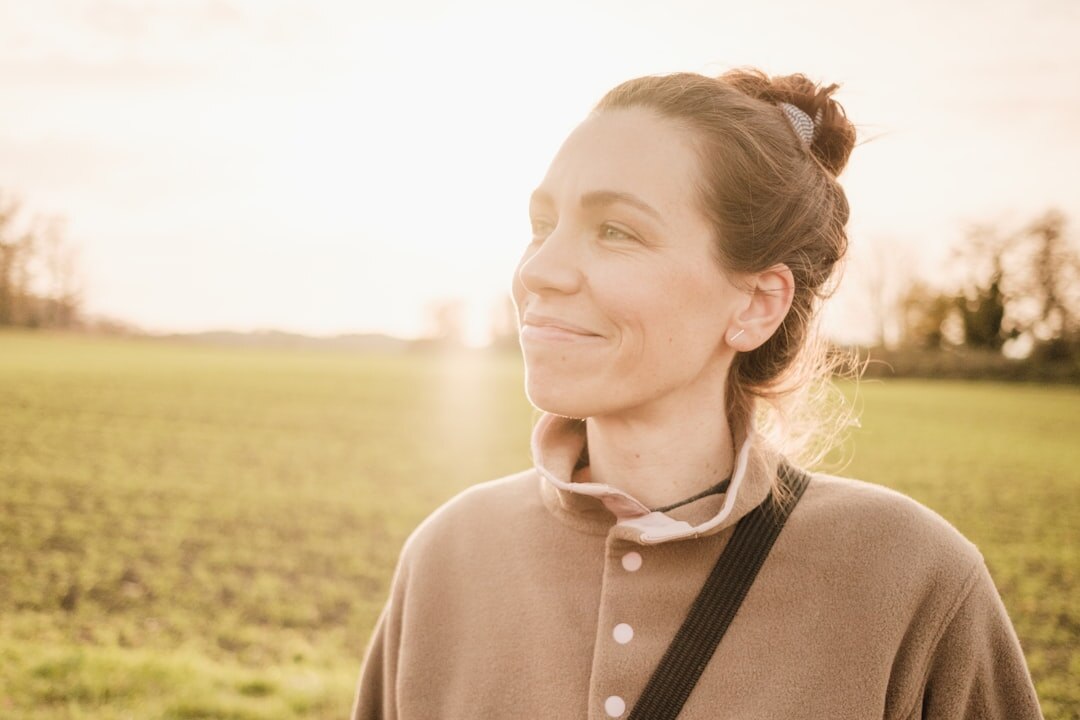 woman smiling at sunrise