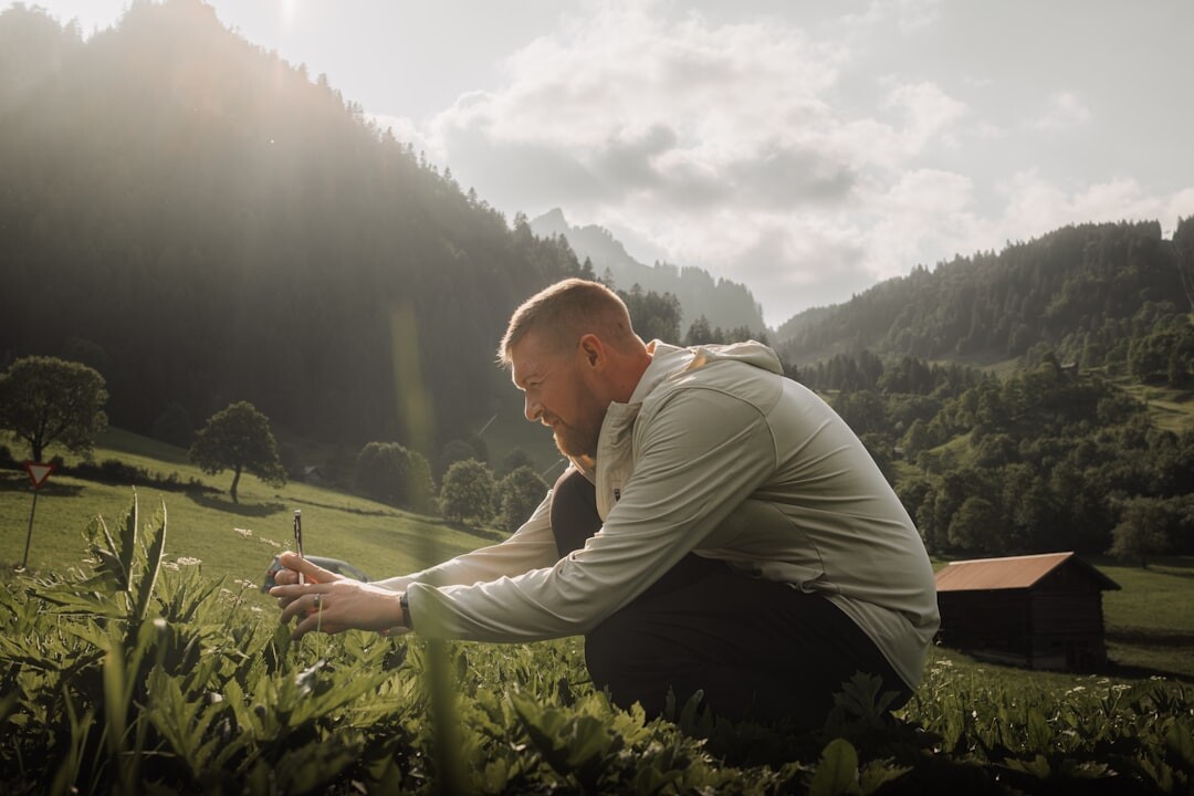 Brazilian man practicing mindful breathing outdoors in a park
